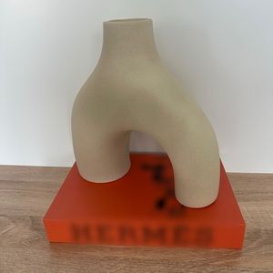 Irregular shaped cream ceramic vase